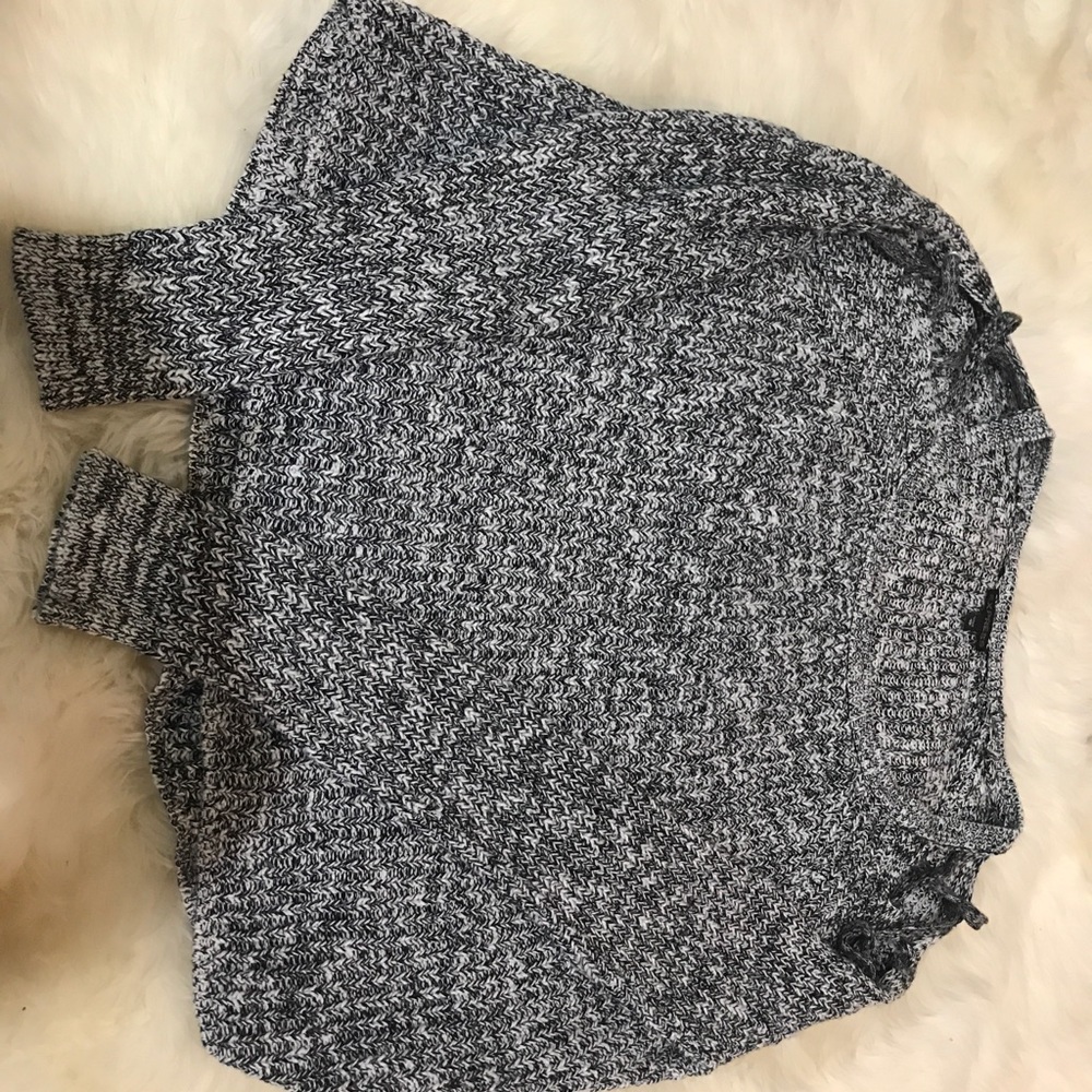 White and black, waffle knit sweater.